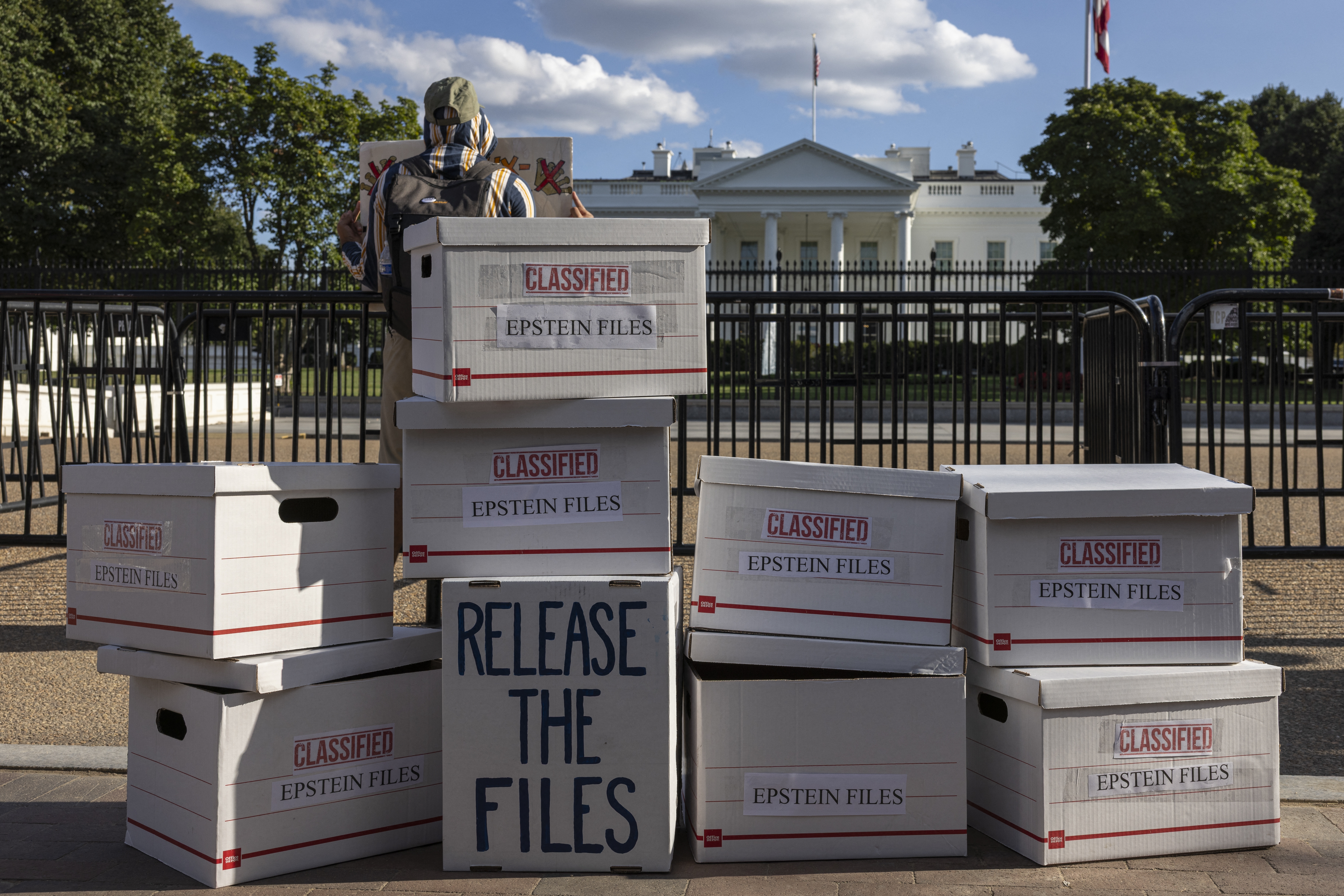 During an anti-Trump protest outside the White House in Washington, D.C., on Sept. 2, demonstrators set up file boxes to represent the Epstein files. On Wednesday, President Trump signed the legislation directing the Department of Justice to release those files.